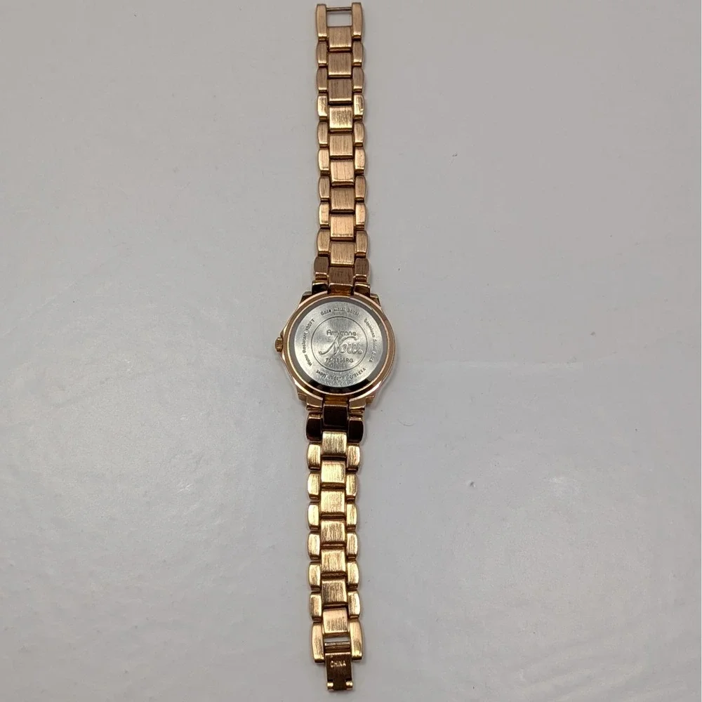 Armitron Now Womens Rose Gold Tone Cream Ceramic Bezel Watch 753896RG Untested